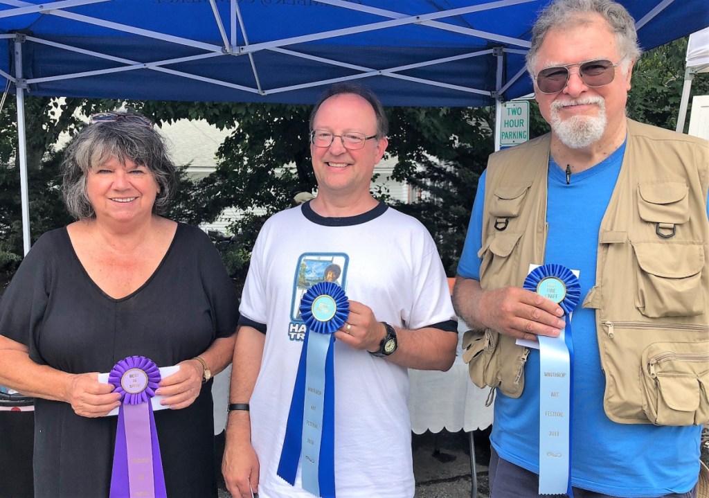 The winners of the 2018 Winthrop Sidewalk Art Festival, sponsored by the Winthrop Lakes Region Chamber, are, from left, painter Irene Duplissis, of Auburn, won Best in Show; painter Ian Hanks, of Standish, won Best Artist; and Donald Kerr, of Winthrop, won Best Crafter for his wire art sculptures.
