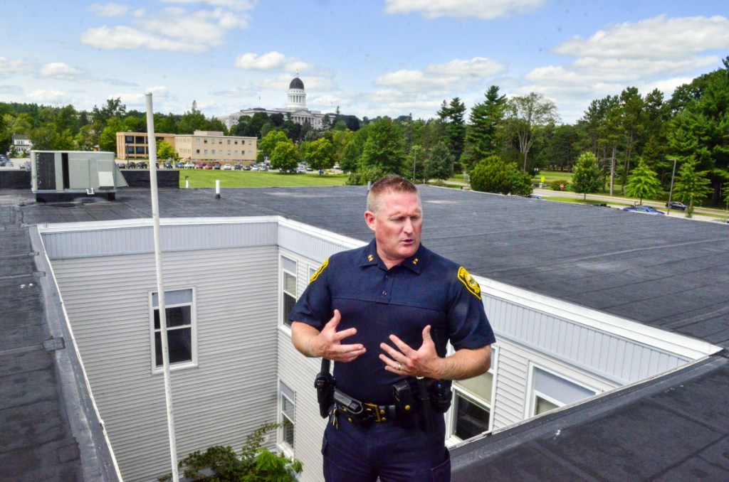 Augusta Police Chief Jared Mills is seen atop the Augusta Police Station on Aug. 21.