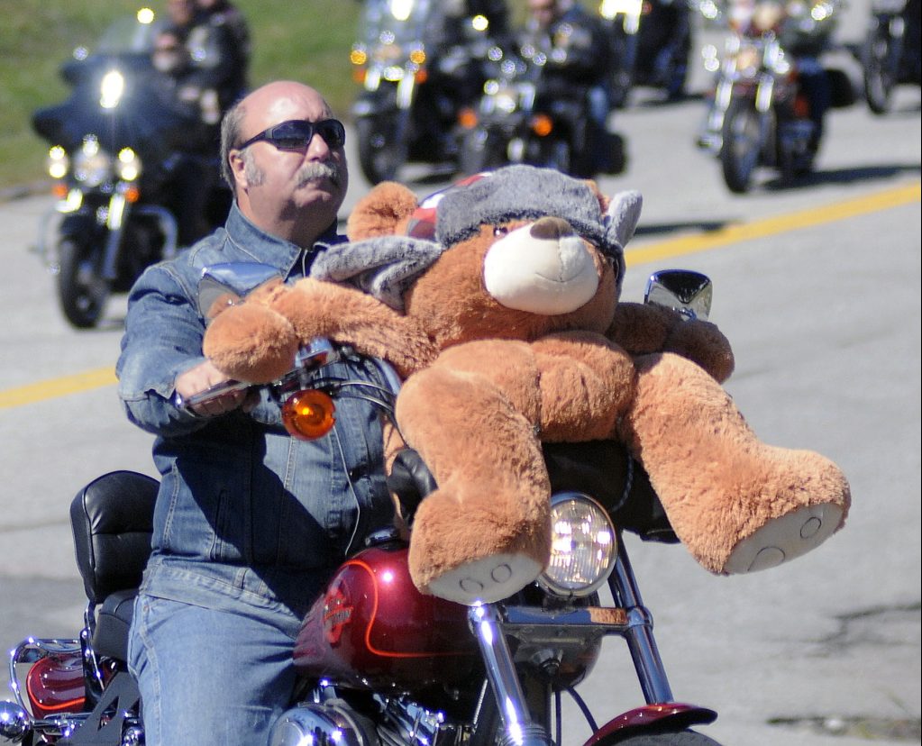 Bikers pour out of the Augusta Civic Center on Sept. 14, 2014, during the 33rd annual United Bikers of Maine Toy Run. Several hundred bikers from across Maine rode to the Windsor Fairgrounds carrying toys to donate to children.