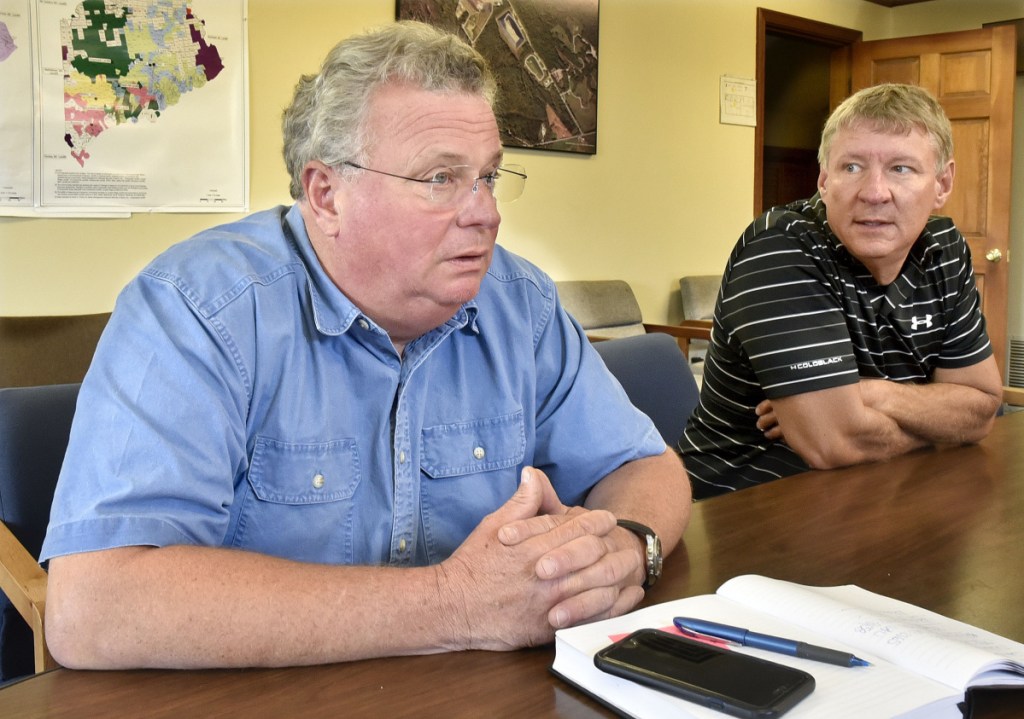 District Manager Jeff McGown, left, and engineer Sherwood McKenney, of Waste Management's Crossroads Landfill, on Wednesday said bird problems are not likely to be an adverse factor if the Norridgewock facility expands according to plan.