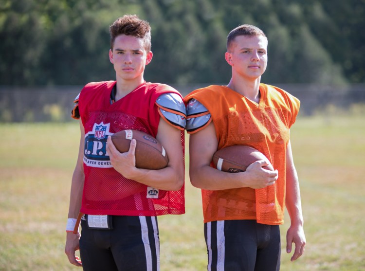 Sean Michaud, left, and brother Cameron Michaud start for the Gardiner football team this season. Sean at quarterback and Cameron at running back.