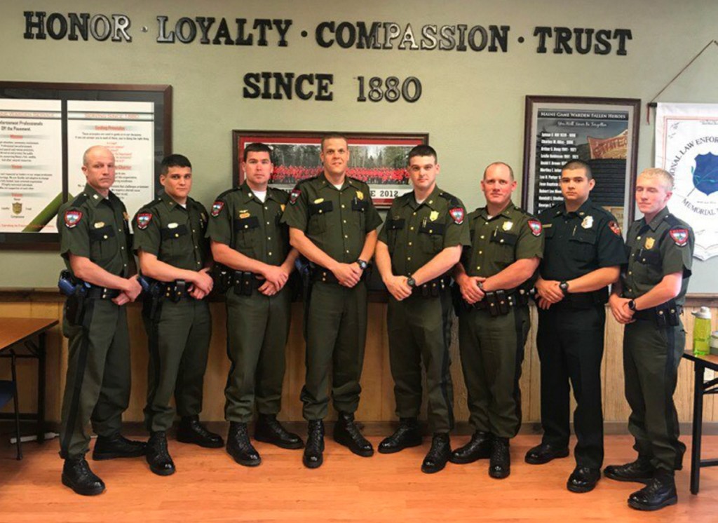 Graduates from left are Warden Jake Voter, from Cornville, who is assigned to The Forks; Warden Michael Latti, from Brunswick, assigned to the Gorham District; Warden Pilot Chris Hilton, from Greenville, assigned to Greenville; Warden Tyler Leach, from Mechanic Falls, assigned to Danforth; Warden James Gushee, from Fort Kent, assigned to Houlton; Warden Tennie Coleman, from Dennistown, assigned to Jackman; Warden Logan Pardilla assigned to the Penobscot Tribal Land; and Warden Brandon Sperrey, from Winterport, assigned to Saco.