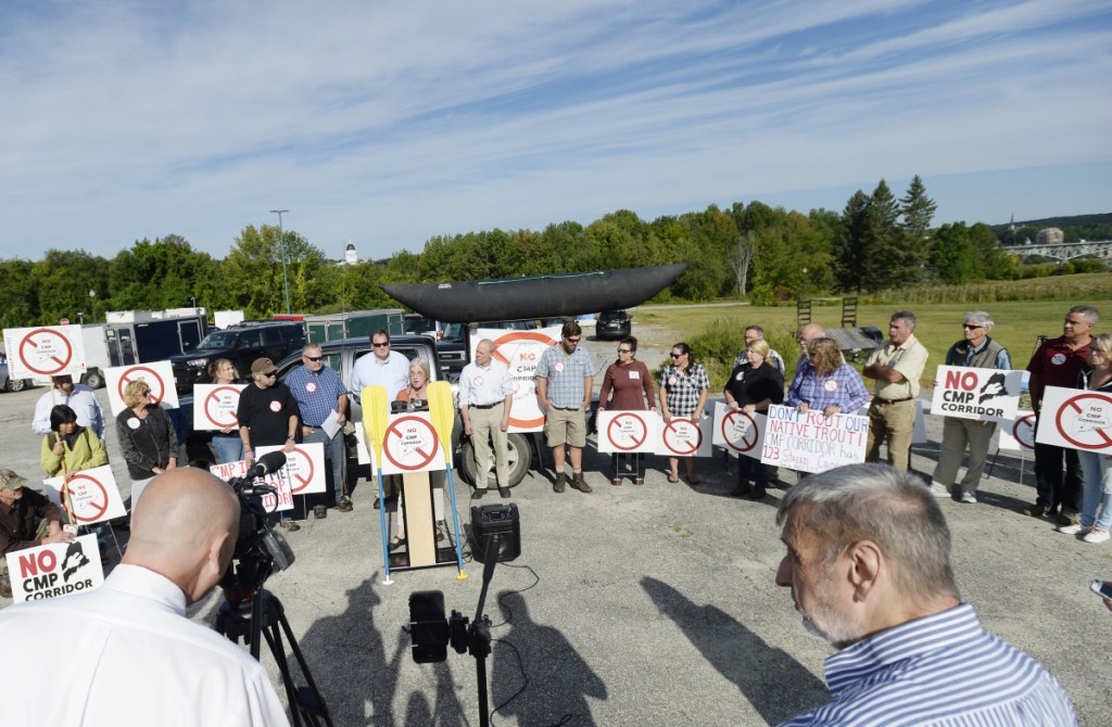 A crowd participates in the Say NO to NECEC Rally on Friday in Augusta. The protest against a proposed 145-mile transmission line through Maine to bring electricity to Massachusetts residents took place outside the Department of Environmental Protection response building in Augusta.