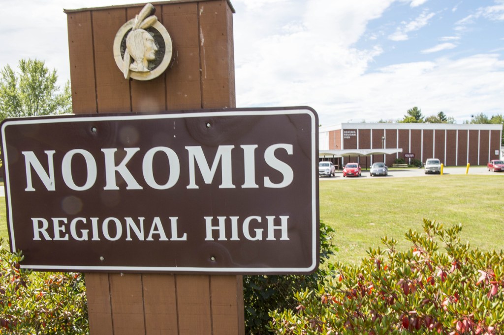 The image of an Indian appears above the Nokomis High School sign Thursday in front of the school in Newport.