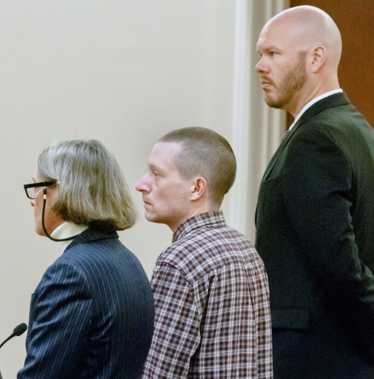 Scott A. Bubar, center, is flanked by his attorneys, Lisa Whittier, left, and Scott Hess, during bail hearing on Wednesday at the Capital Judicial Center in Augusta.