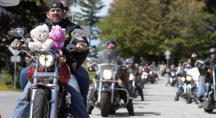Motorcyclists ride through Augusta on Sunday at the annual United Bikers of Maine Toy Run.