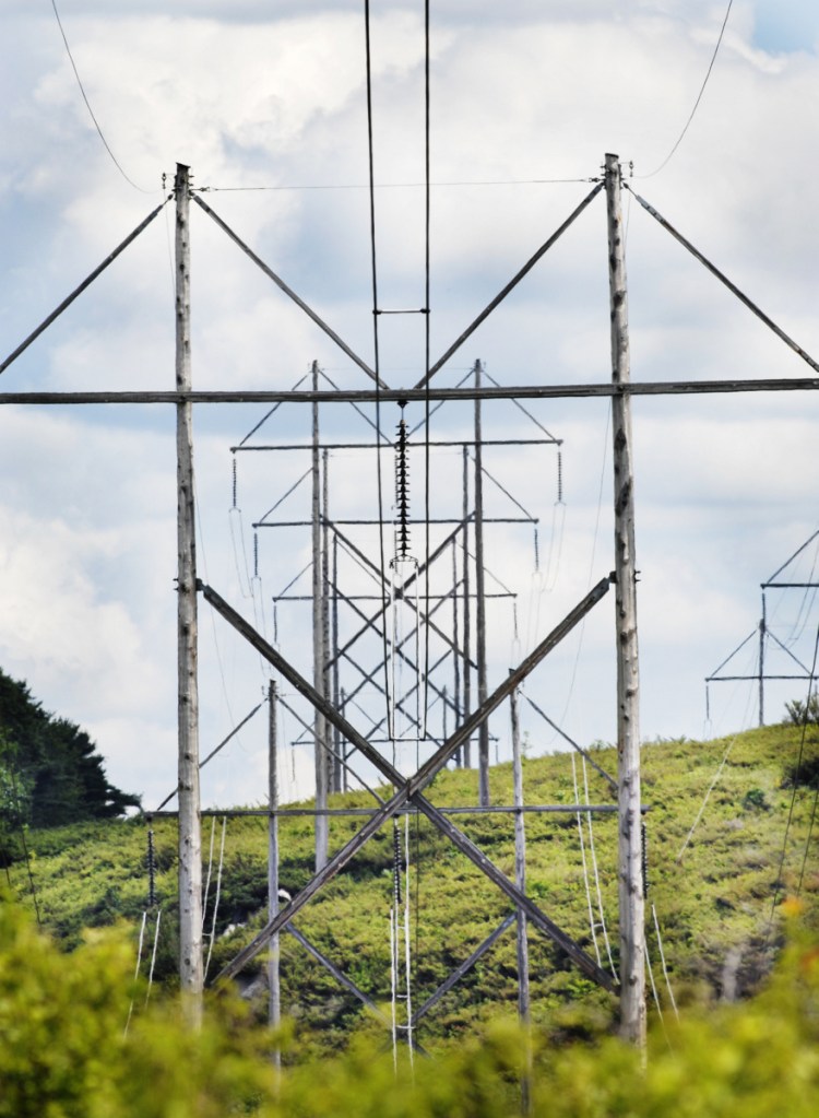 These 345-volt transmission lines cross U.S. Route 201 in Topsham. Hearings on CMP's proposal to build a 145-mile transmission line from Quebec to Lewiston will be held Friday at the University of Maine in Farmington and The Forks Town Hall.