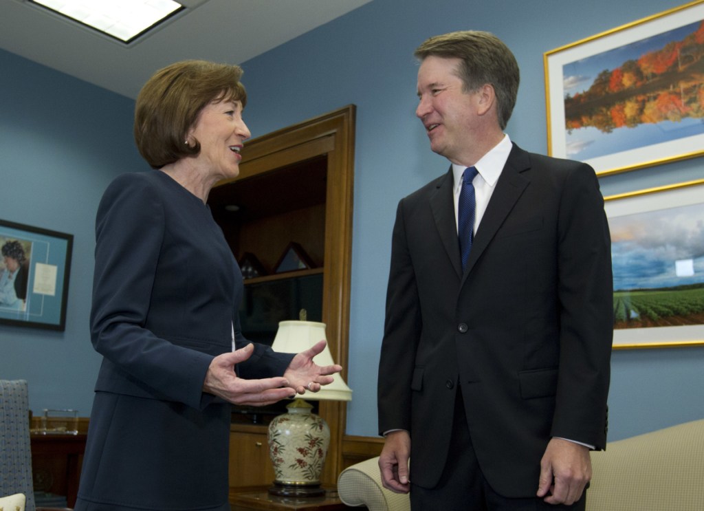 Sen. Susan Collins speaks with Supreme Court nominee Judge Brett Kavanaugh at her office, before a private meeting. As a rare potential swing vote in the Senate, she is the focus of an intense lobbying effort.