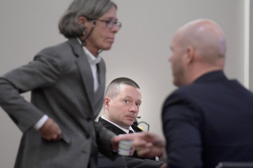 Scott Bubar, center, watches his attorneys, Lisa Whittier and Scott Hess, prepare opening remarks Monday at Bubar's trial in Augusta. Bubar is standing trial for his alleged attempted murder of a sheriff's deputy during a shootout on May 19, 2017, in Belgrade.