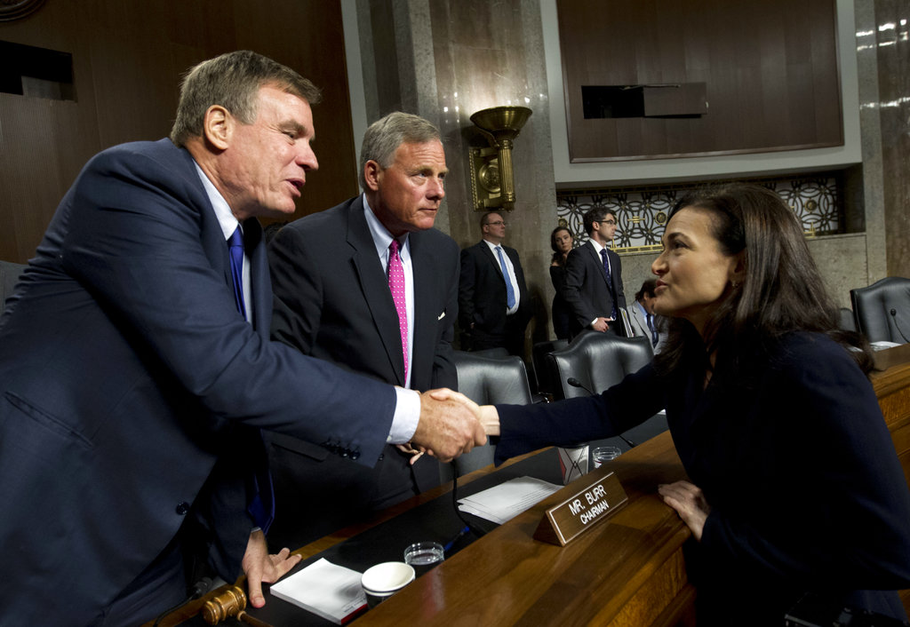Senate Intelligence Committee Vice Chairman Mark Warner, D-Va., left, and Chairman Sen. Richard Burr, R-N.C., center, shake hands with Facebook COO Sheryl Sandberg after Senate Intelligence Committee hearing on 'Foreign Influence Operations and Their Use of Social Media Platforms' on Capitol Hill, Wednesday in Washington. 