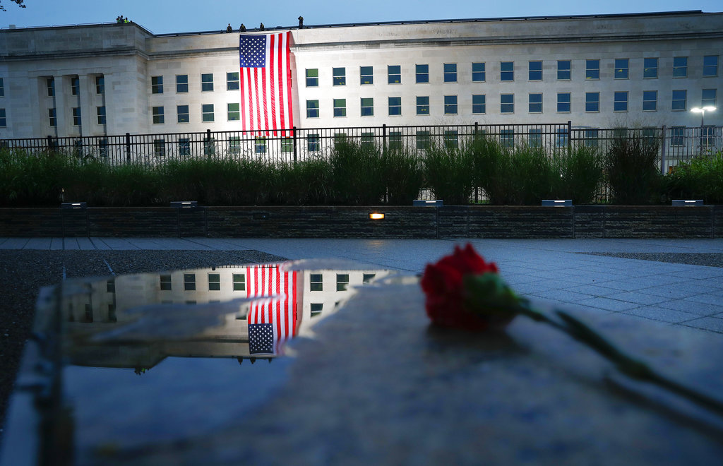 A U.S. flag is unfurled at sunrise on Tuesday, Sept. 11, at the Pentagon on the 17th anniversary of the Sept. 11, 2001, terrorist attacks. 