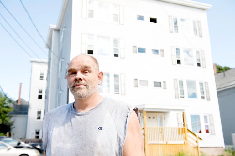 "I buy the worst of the worst in Lewiston," said Lewiston landlord Jay Allen. He bought two apartment buildings on Blake Street that were full of lead and on the verge of being torn down. He is finished with one and is working on the other behind the one pictured. 