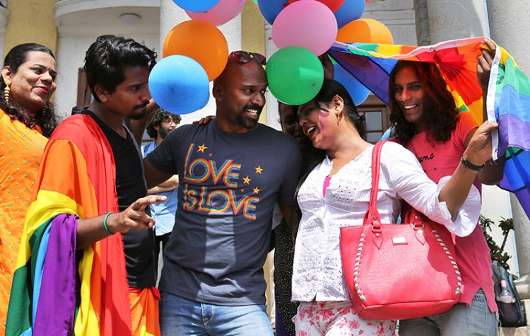Members of the LGBT community and their supporters celebrate after the India's top court struck down a colonial-era law that made homosexual acts punishable by up to 10 years in prison, in Bangalore on Thursday.