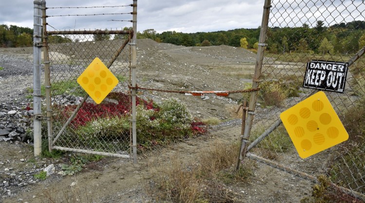 A locked gate leads to a gravel filled area off the West River Road in Waterville where a shooting range may be developed for the Waterville Police Department.