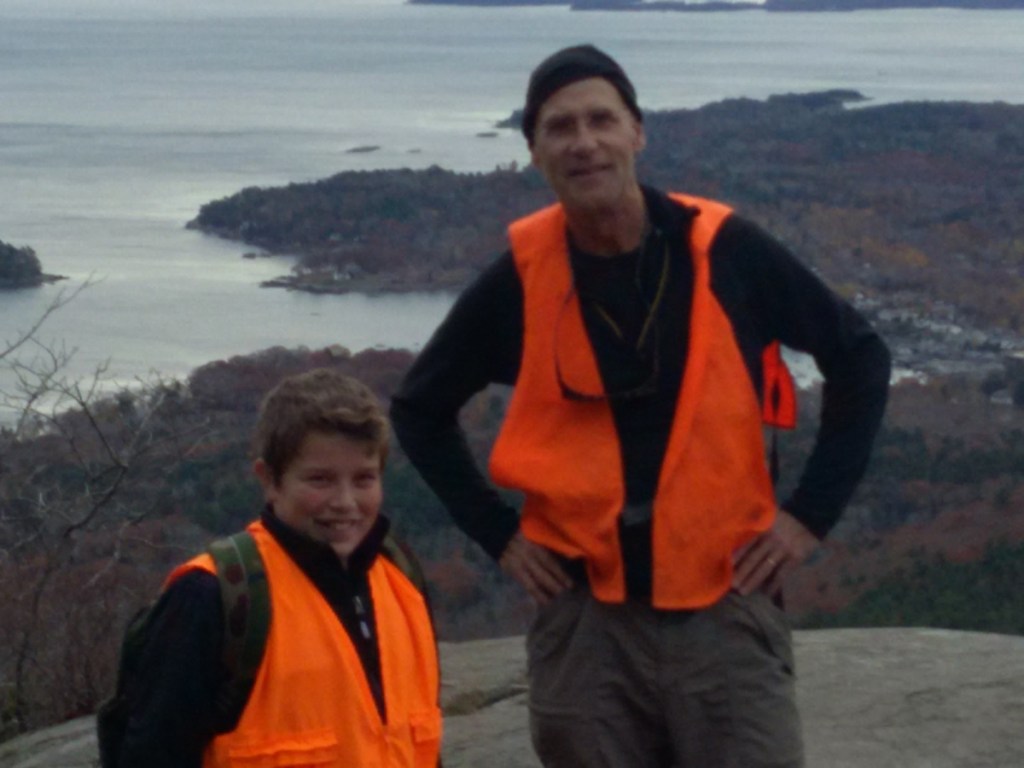 Reaching New Heights: Little Brother Jaxen Wiegand and his Big Brother Richard Behr hiking on one of their weekly visits as part of their community-based match through Big Brothers Big Sisters of Mid-Maine.