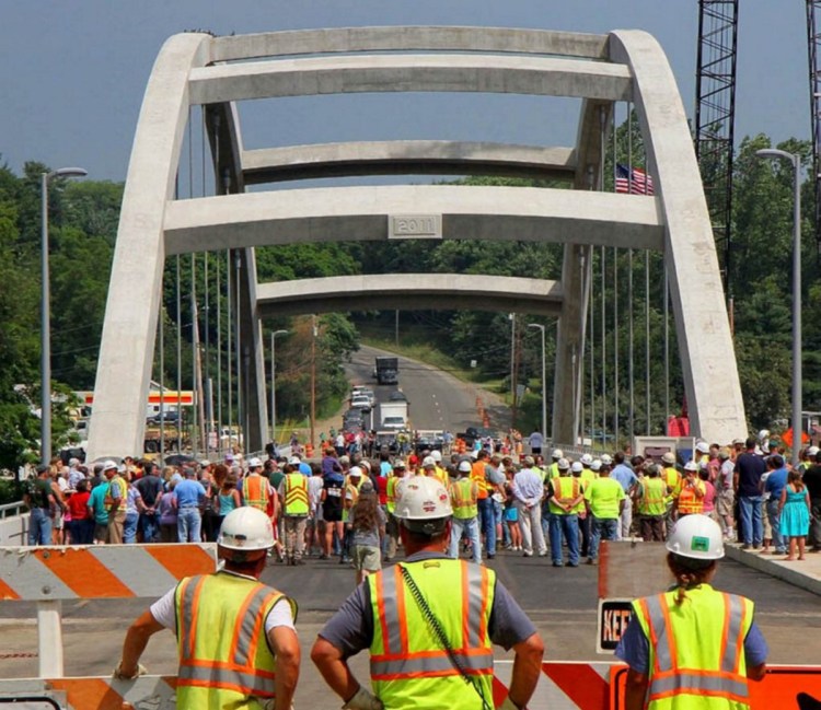 Maine Department of Transportation workers, spectators and dignitaries gather in July 2011 for a ceremony opening a $22 million bridge in Norridgewock. The Legislature passed a bill in June calling for naming it the Cpl. Eugene Cole Memorial Bridge, in honor of the Somerset County sheriff's deputy who was killed April 25 while on duty.