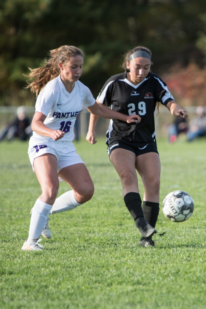 Waterville's Jayda Murray and Winslow's Desiree Veilleux battle for the ball during a Kennebec Valley Athletic Conference Class B game Friday afternoon in Winslow.