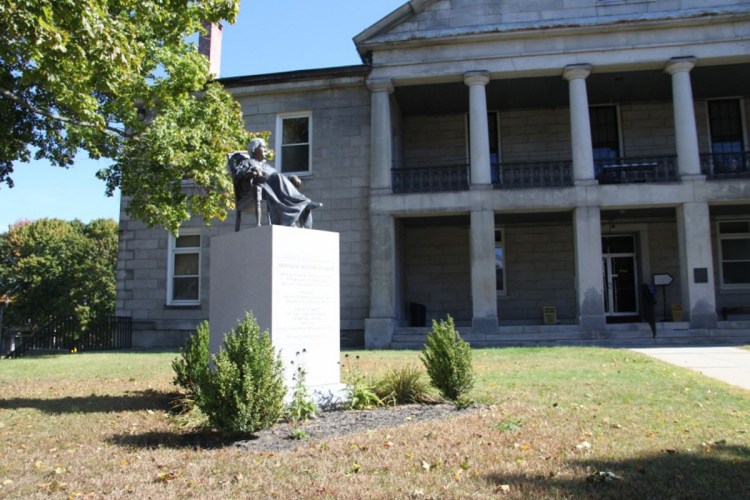 A statue depicting Melville Weston Fuller (1833-1910) gazes out over State Street traffic Saturday on the lawn in front of the Kennebec County Courthouse. Fuller was sworn in as U.S. Supreme Court chief justice 130 years ago Monday.
