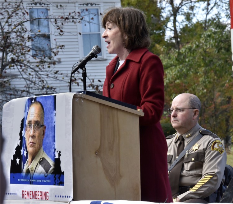 Sen. Susan Collins addresses hundreds of family, friends, police and rescue personnel at the Corporal Eugene Cole Memorial Bridge dedication ceremony in Norridgewock on Sunday. At right is Somerset Sheriff Dale Lancaster.