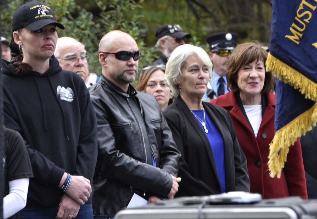 U.S. Sen. Susan Collins, R-Maine, right, stands beside Sheryl Cole, widow of slain Somerset Sheriff Deputy Cpl. Gene Cole and other family members during the dedication of the Corporal Eugene Cole Memorial Bridge in Norridgewock on Sunday. Collins later said had been hearing "very positive" feedback from Mainers regarding her vote the day before to confirm now-Supreme Court Justice Brett Kavanaugh.