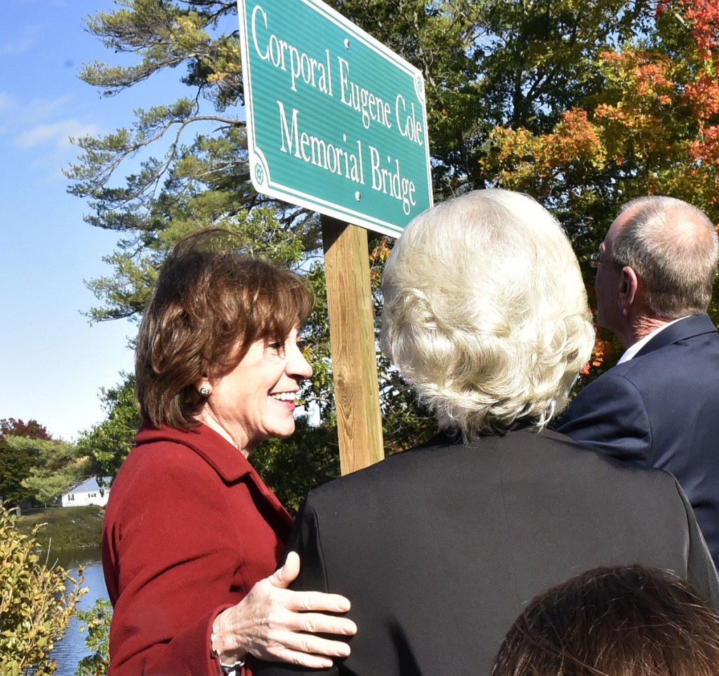 U.S. Sen. Susan Collins, R-Maine, left, reaches out to Sheryl Cole, widow of slain Somerset Sheriff Deputy Cpl. Gene Cole, after a sign was unveiled during the dedication of the Corporal Eugene Cole Memorial Bridge in Norridgewock on Sunday. Collins later said had been hearing "very positive" feedback from Mainers regarding her vote the day before to confirm now-Supreme Court Justice Brett Kavanaugh.