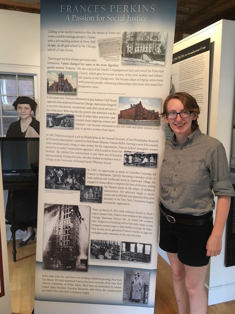 2018 Mount Holyoke College/Frances Perkins Center intern Ally Kelley with a travel exhibit panels.