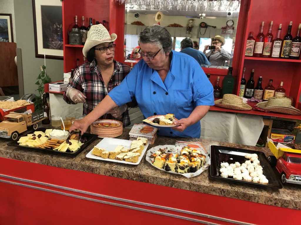 Recreation assistant Leni McCandless and Food Service director Eileen Franklin serving from the Saloon.