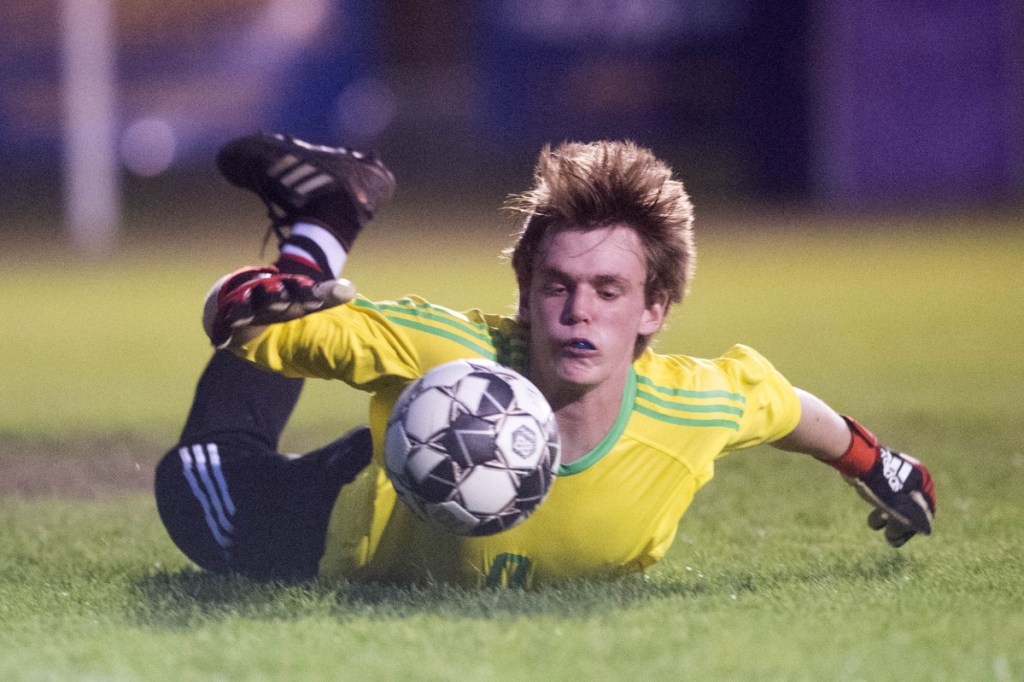 Hall-Dale goalie Sam Sheaffer makes a save during a game against Mt. Abram on Tuesday night in Strong.