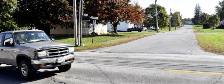 Traffic passes Belanger Street in Winslow at the intersection of the Cushman Road on Wednesday. After complaints from residents, the street may become the third in town to ban heavy tractor-trailer truck traffic after the Town Council took an initial vote Tuesday night.