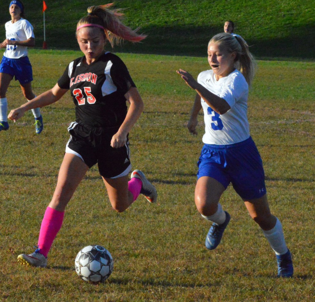 Madison's Taylor Tillinghast races down the field to the ball as Lisbon's Caitlyn Hall pursues during a game Wednesday in Lisbon.