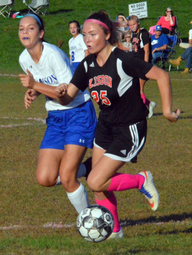 Madison's Grace Linkletter, left, and Lisbon's Caitlyn Hall run side-by-side down the field during Wednesday's MVC girls soccer game in Lisbon.