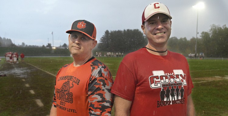  Cony defensive coordinator Brandon Terrill, right, and Gardiner defensive coordinator Pat Munzing at Cony High School in Augusta on Wednesday.  Both coaches are leading strong defenses for good teams heading into this week's Cony-Gardiner game.