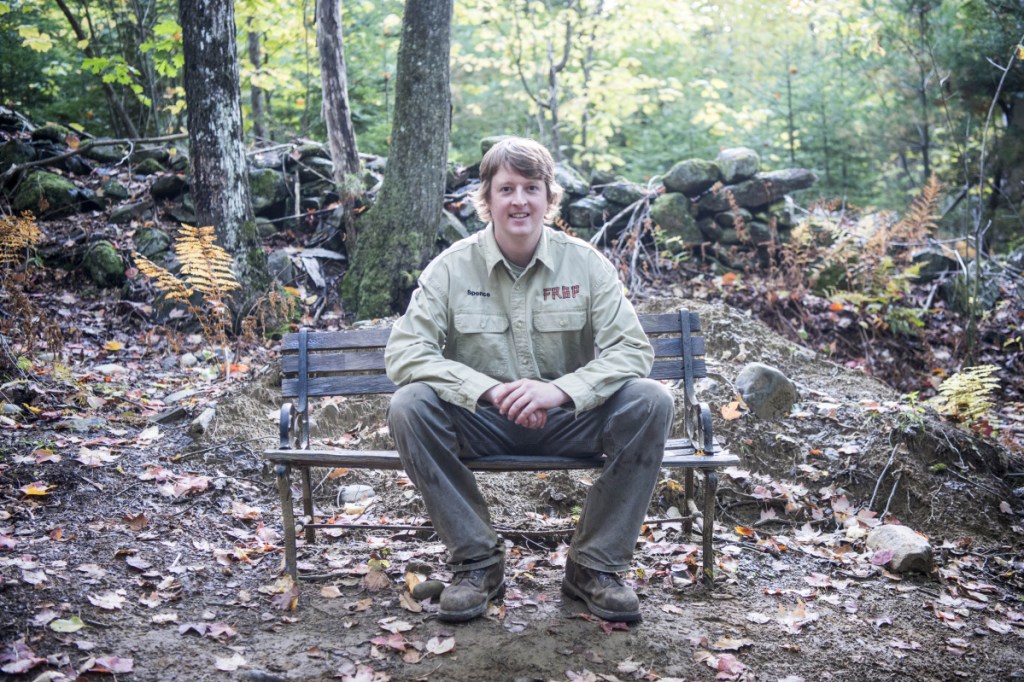 Spencer Lee, owner of Freeman Ridge Bike Park in Freeman Ridge Township, takes a seat Oct. 3 along his network of trails.