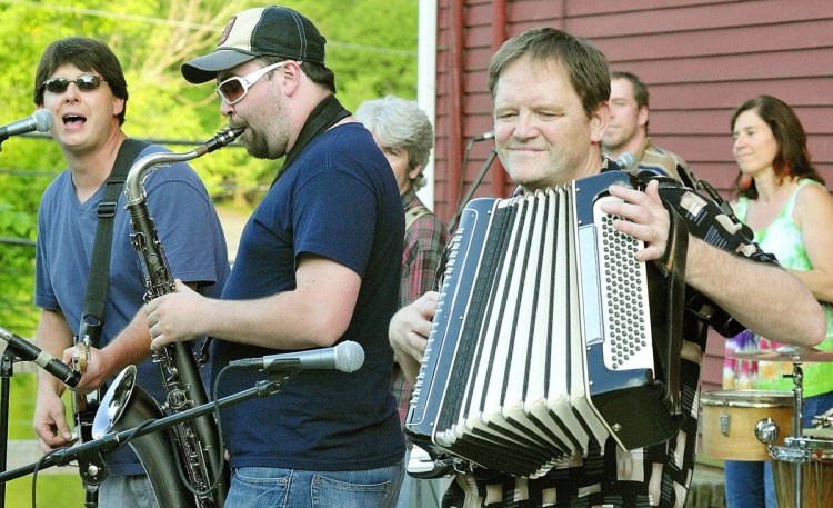 Tim Sullivan, left, Tyler Card and Bob Colwell perform songs by Paul Simon during a Rock on The River concert June 21, 2011, in downtown Hallowell.