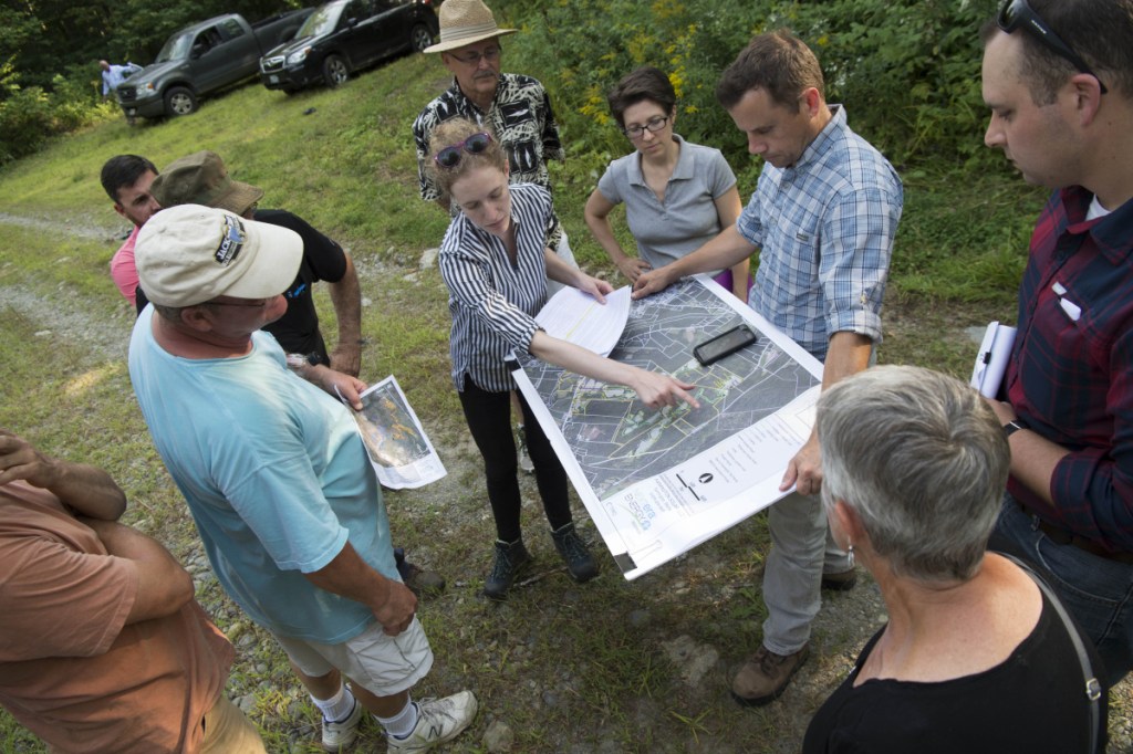 Liz Peyton, project manager for NextEra Energy, gives a tour of the proposed solar power project on Sandy Hill Farm to residents in Farmington on Aug. 29. A public hearing Monday provided Farmington residents the opportunity to comment on the proposed 490-acre solar farm.