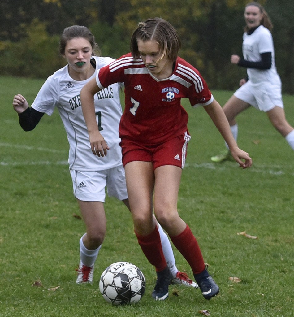 Messalonskee's Cloe Sisson, right, and Oxford Hill's Kaity Montelongo go after the ball during a game Monday in Oakland.