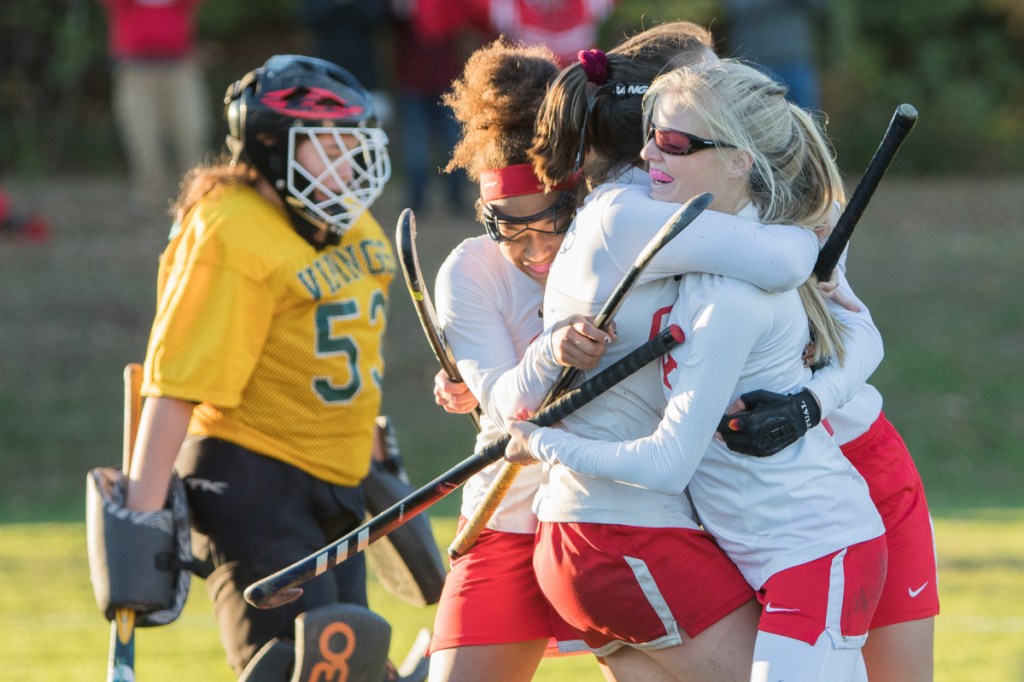 Photo by Jennifer Bechard 
 Cony's Sophie Whitney, right, celebrates with teammates Anna Stolt, center, Kami Lambert , left, and Julia Reny, back, after scoring the winning goal in overtime in a Class A North quarterfinal game against Oxford Hills onTuesday in Augusta.