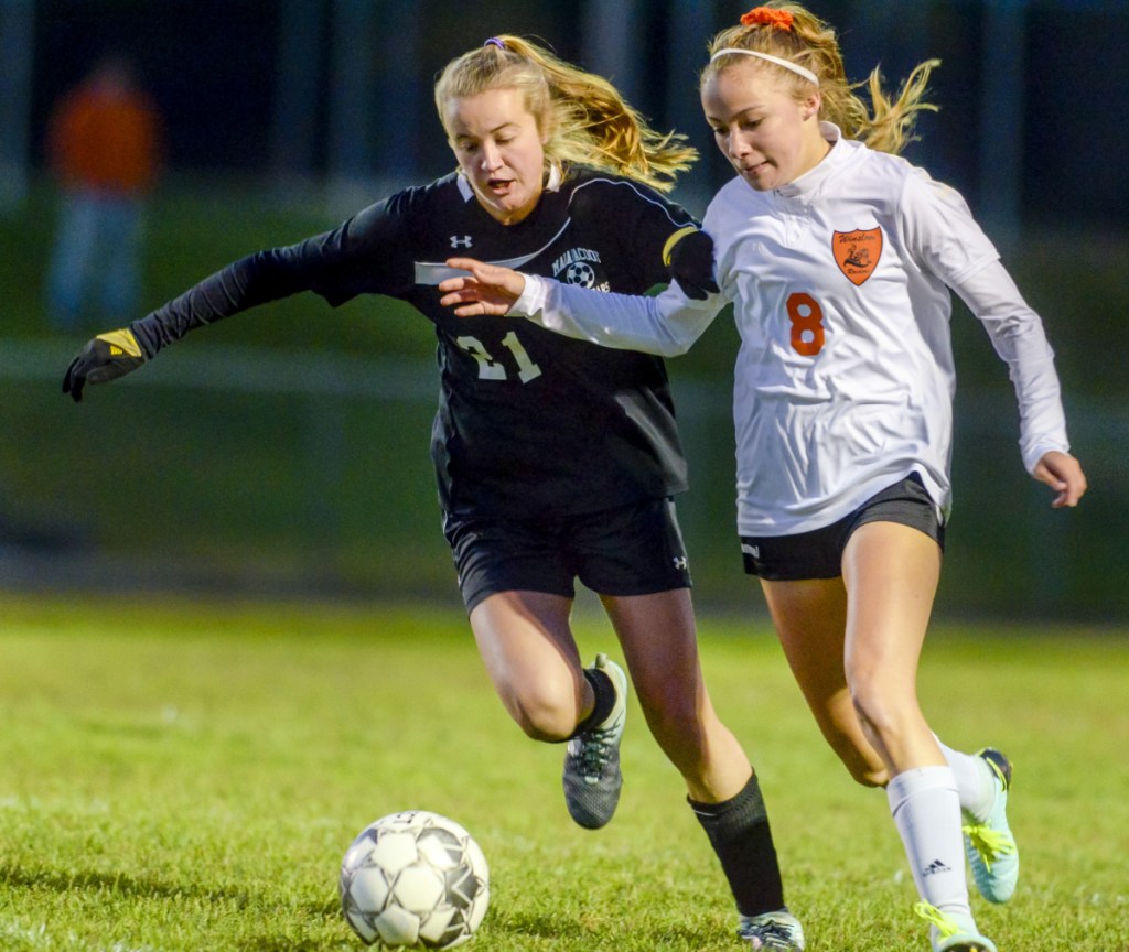 Maranacook's Grace Dwyer, left, and Winslow's Katie Doughty battle for a ball during a game Tuesday in Readfield.