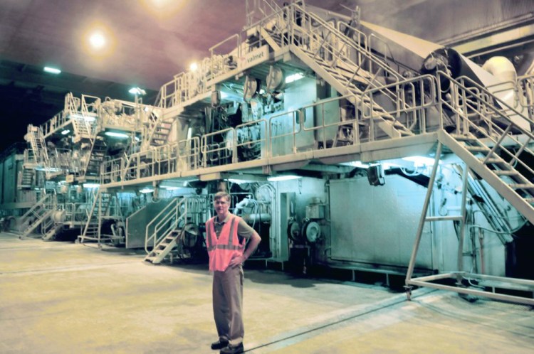 Russ Drechsel, president and CEO of UPM Madison, stops before the mill's giant paper-making machine during a tour of the company in Madison on Aug. 20, 2015. The mill closed at the end of May 2016. The paper machine was sold in the summer of 2018 and is being moved to China.