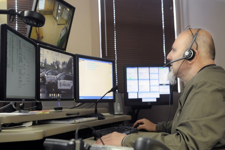 City of Augusta dispatcher Mike Rankins speaks with police officers while handling a radio call at the City's emergency communications center on April 16, 2015. The contracts of more than 20 Kennebec County towns that contract for law enforcement dispatch services with the state-run Regional Communications Center through the Kennebec County Sheriff's Office will expire in June 2019. The Augusta police dispatch service has been discussed as an alternative, but that might be an expensive proposition.