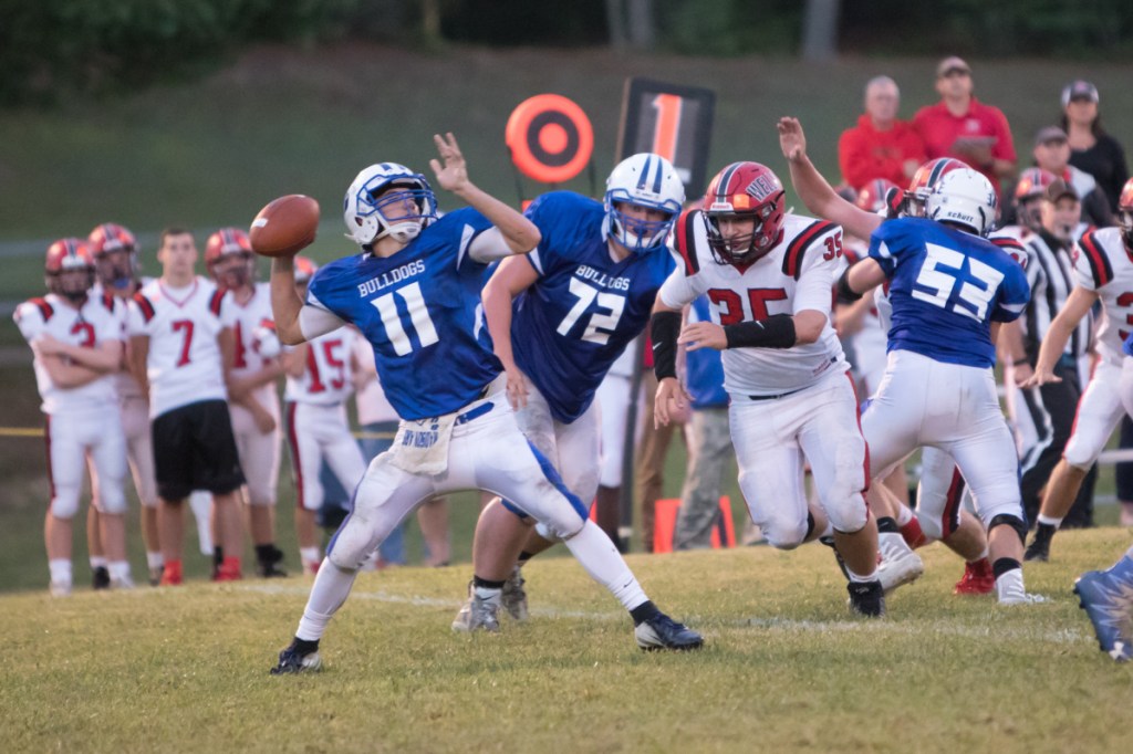 Madison quarterback Eric Wescott gets ready to air out a pass during a game against Wells earlier this season.