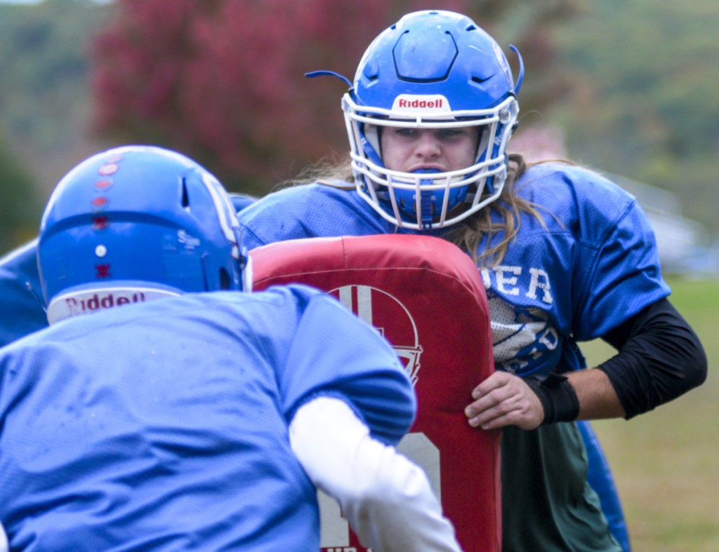 Oak Hill linebacker Ethan Richard works through a drill during practice Wednesday in Wales.