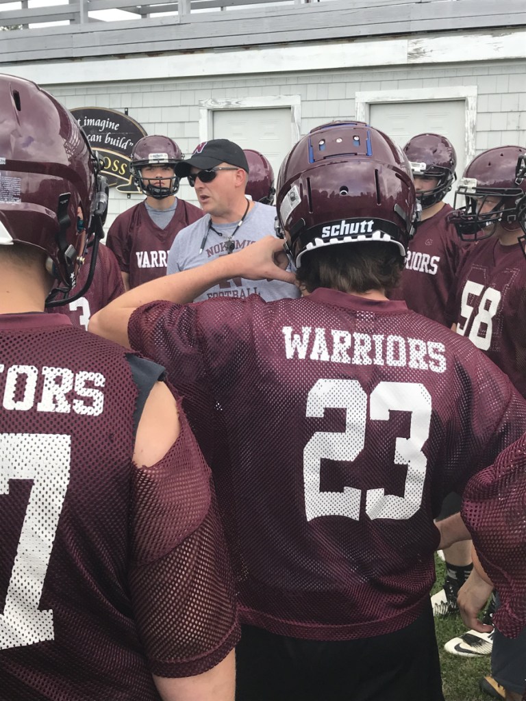 Staff file photo by Michael G. Seamans
Nokomis head coach Jake Rogers talks to his players before a practice earlier this season in Newport. The Warriors play rival Maine Central Institute on Friday night in Pittsfield.