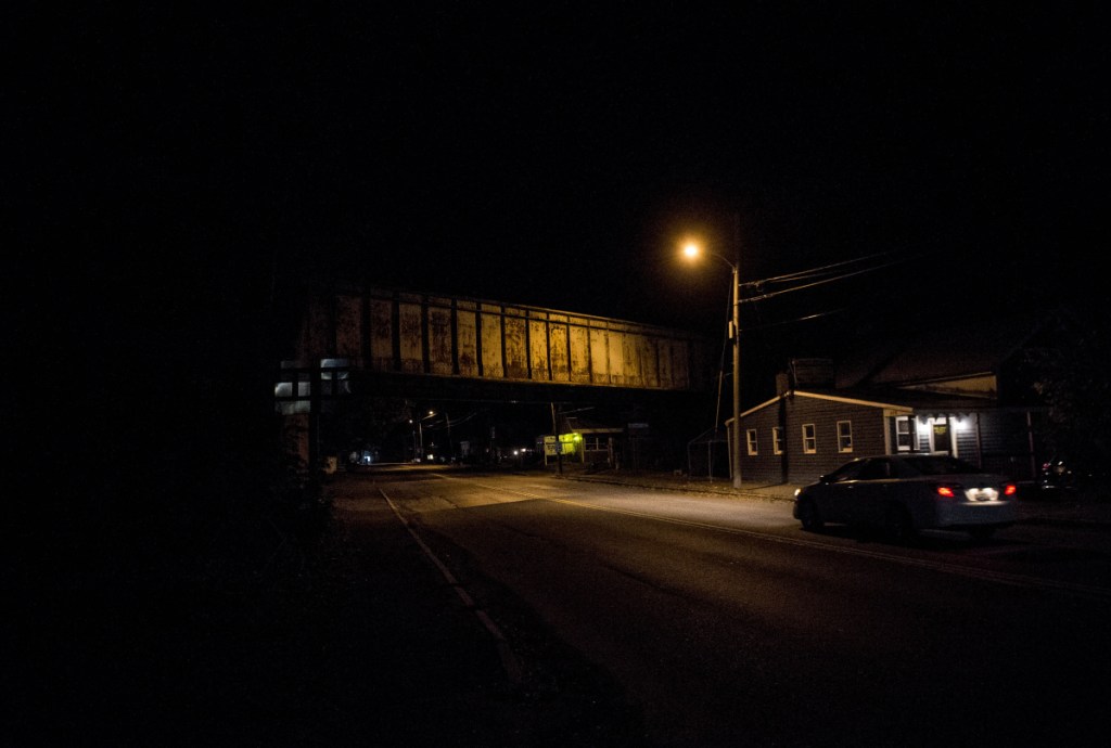 A lone street light illuminates Upper Main Street next to the train overpass in Fairfield on Friday night.