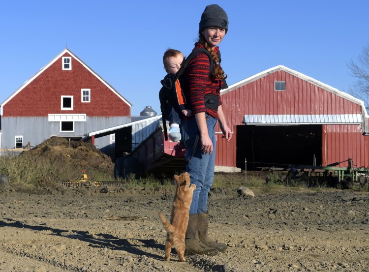Alexis MacDonald and her son, Rory, on the site of the pad of the future composting operation at her family's Washington farm on Friday. Bo Lait Farm received a Department of Environmental Protection grant last month to start the composting businesses. Bo Lait Farm is teaming with another composting company to help divide the work load.