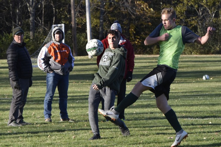 Mount View  soccer players Matt Overlock, left, and Jackson Martin practice Monday in Thorndike.
