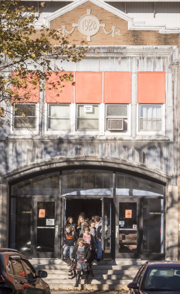 Students emerge from Winslow Junior High School at the end of the school day Nov. 8, 2017. Plans to renovate the elementary and high schools are moving forward with the authorization of contracts for the work. The junior high will be closed, but may be repurposed for other uses.