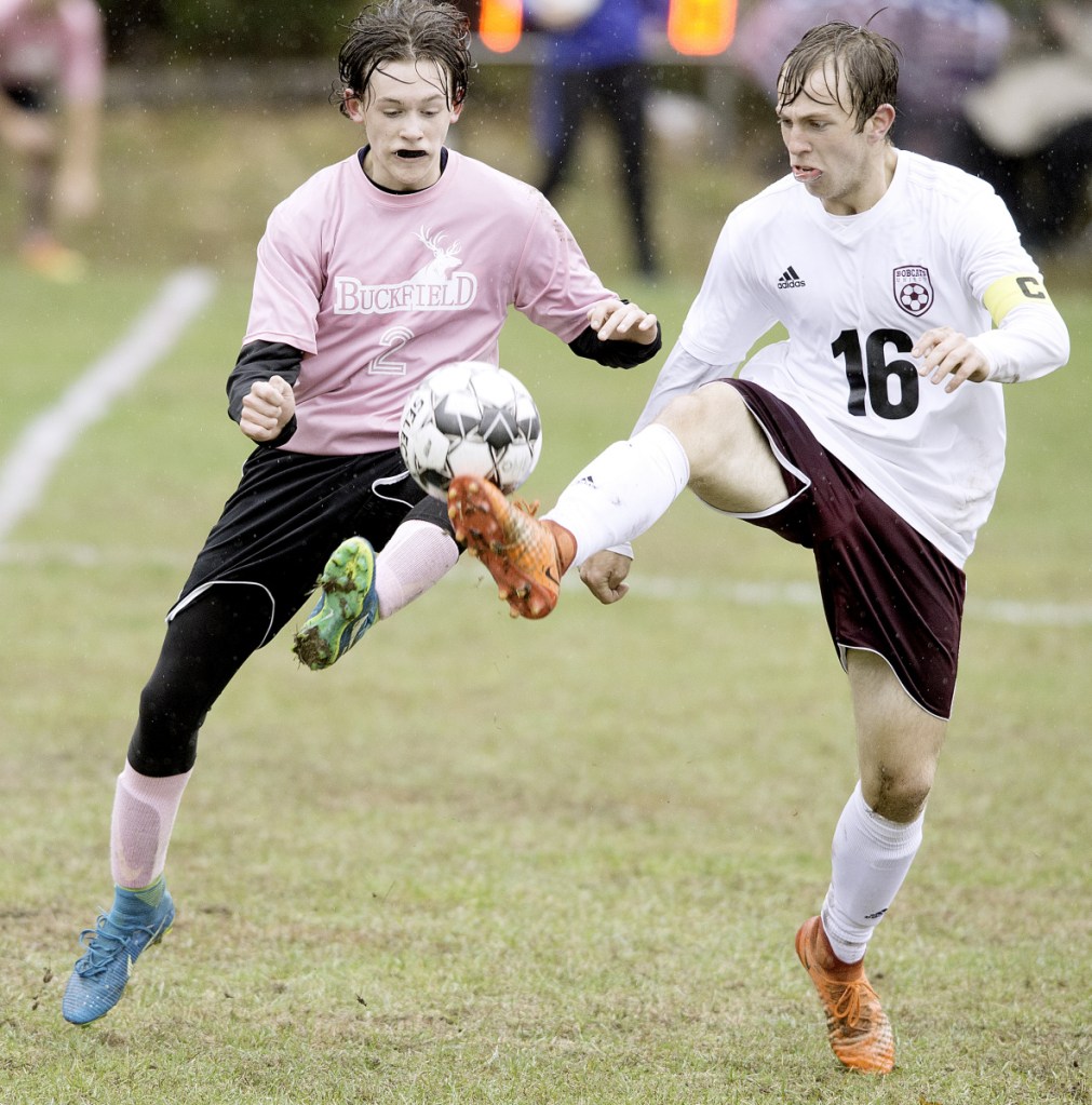 Buckfield's Elijah Chasse, left, and Ford Strout of Richmond compete for the ball during the first half of a Class D South quarterfinal game Tuesday in Buckfield.