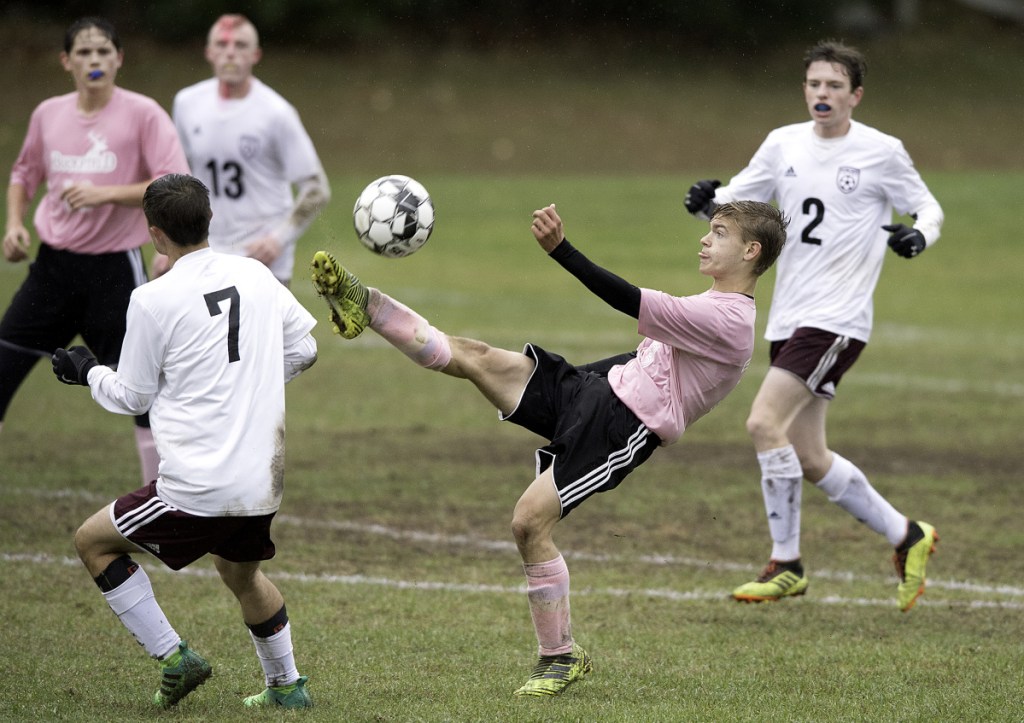 Buckfield's Victor Verrill bicycle kicks the ball against Richmond during Tuesday's Class D South quarterfinal game in Buckfield.