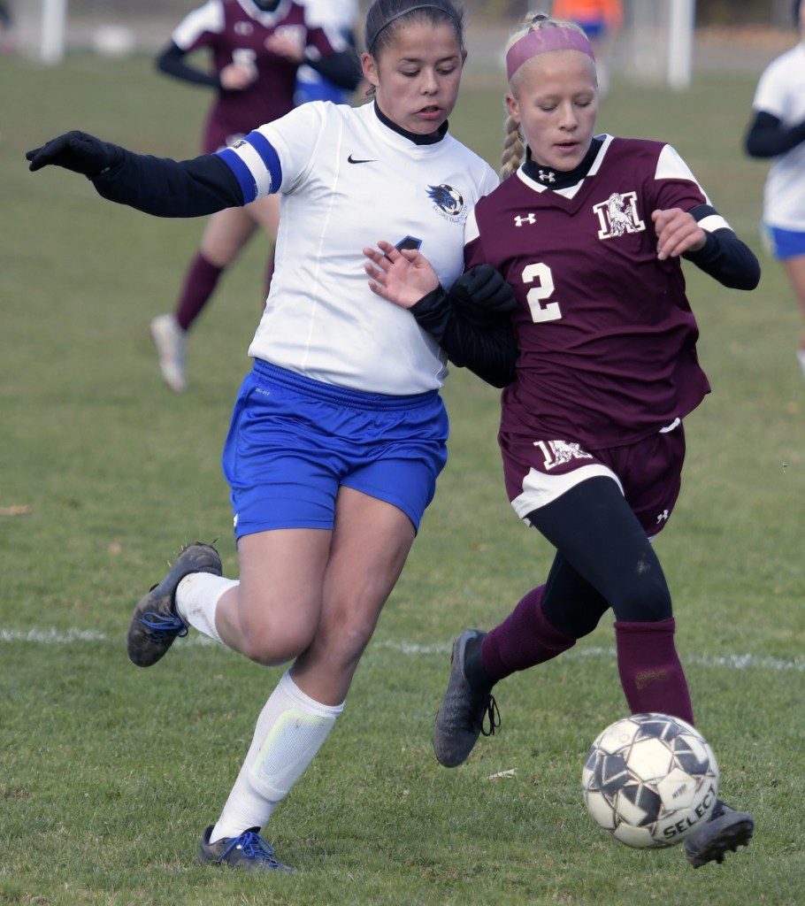 Monmouth's Audrey Fletcher, right, collides with Sacopee Valley's Lindsey Hendricks during a Class C South quarterfinal game Thursday in Monmouth.